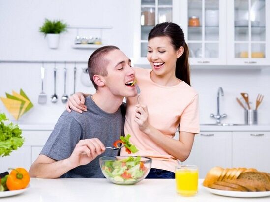 Girl feeds her man with products to increase potency